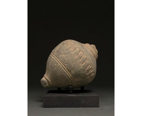 900-1200 AD, Byzantine. Decorated Byzantine "fire grenade" comprising a cream ceramic vessel with a spheroconical body, and s