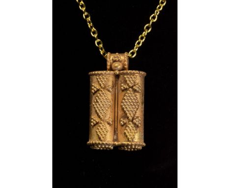 100-300 AD. Roman. Gold pendant with double tubular body and rounded suspension loop. The top and bottom of the tubes are dec