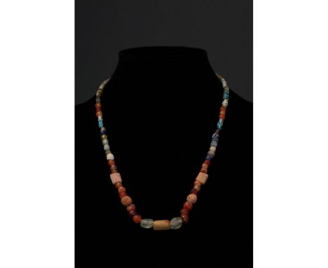 Ca. 100-300 AD. Roman. A restrung necklace of Roman beads comprising multiple opaque and transparent sub- spherical, tubular 