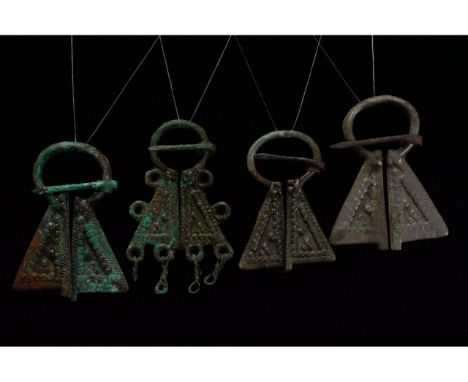 Ca. 700-1100 AD. Viking Age. A collection of four cast Viking era 'Omega' penannular brooches, each with a circular hoop, rou