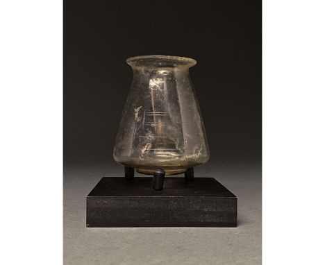 100-300 AD. Roman. Magnificent clear glass beaker with a slight greenish tint, comprising a slightly flaring rim, inverted co