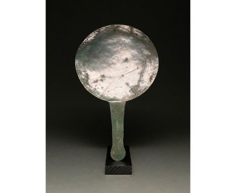 100-300 AD, Roman. Beautiful tinned bronze mirror with discoid form, and a flattened, rectangular projecting handle featuring