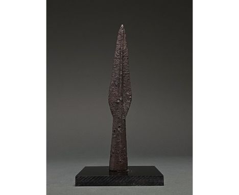 C. 300-500 AD Roman. An iron spearhead comprising a squat leaf-shaped, lentoid sectioned blade with a raised midrib and a soc
