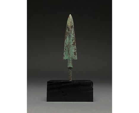 1200-700 BC, Greek Archaic Period. This bronze speak has a leaf-shaped blade with raised midrib and barbs, road neck and a ta