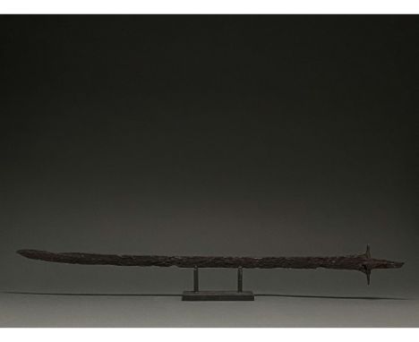 C. 600 AD. Migration Period. A long iron sword with a long, pointed, bevelled blade, a rectangular guard, and a long, rectang