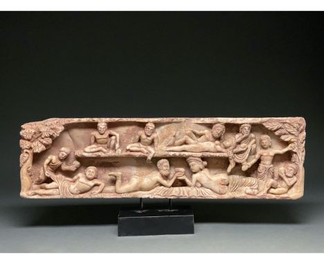 100 AD or later. Roman-style. Rectangular Roman-style marble plaque framed to the left and right by trees and ranged over two