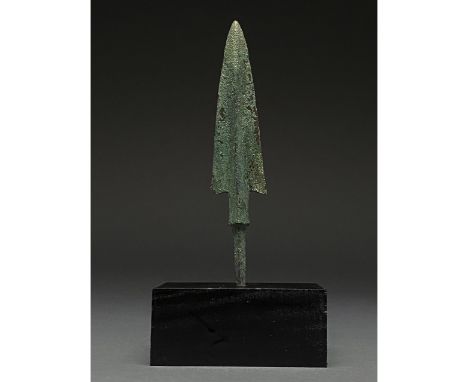 1200-700 BC, Greek Archaic Period. This bronze spear has a leaf-shaped blade with raised midrib and barbs, board neck and a t