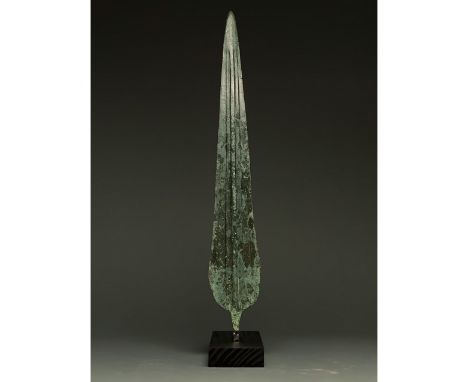 1200-700 BC, Greek Archaic Period. This beautiful bronze sword has a tapering, bevelled blade with raised midrib and a sub-re