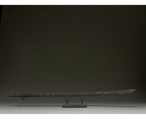 C. 600 AD. Migration Period. A long iron sword with a long, pointed, bevelled blade, a rectangular guard, and a long, rectang