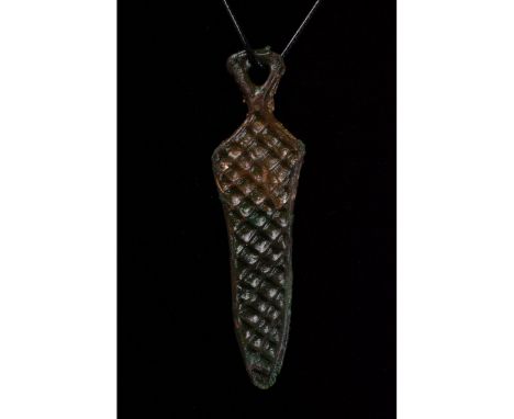 700-1100 AD. Viking Age. Bronze sword-shaped amulet with suspension loop at the top, and a stylised depiction of a leaf-shape