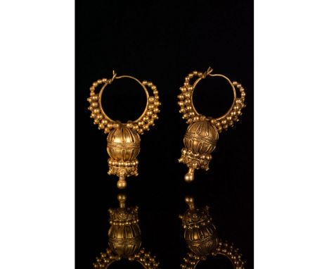 100-300 AD. Roman period. An elaborate pair of gold earrings each comprising (from top to bottom): a circular hoop flanked on