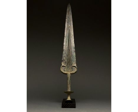 1200-700 BC, Greek Archaic Period. This beautiful bronze sword has a leaf-shaped, bevelled blade with a fuller or â€œblood gr