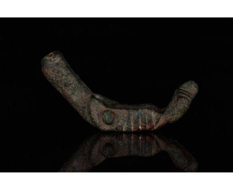 c. 100-300 AD. Roman. A large bronze pendant comprising an upward-pointed phallus at one end, ribbed sides enclosing a suspen