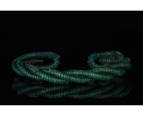 700-1100 AD, Viking Age. A heavy bronze twisted bracelet comprising several strands of bronze with incised linear decoration 