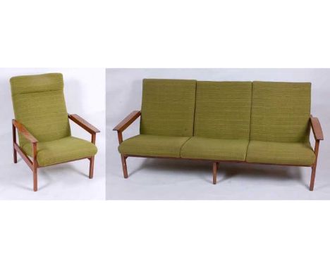 Guy Rogers - a 1960s teak framed two-piece lounge suite, comprising; three-seater sofa and single armchair, having green clot
