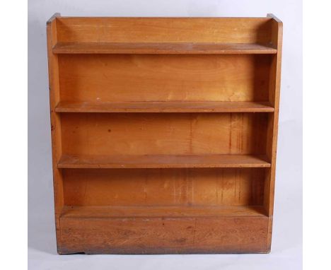 A 1950s light oak four-tier double-sided open bookshelf, of slightly tapering form, h.115cm, w.107cm, d.45.5cm 