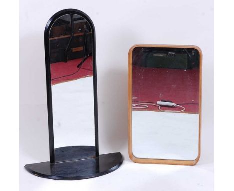 An Art Deco style black painted arched mirrored wall shelf, having a semi-circular integral surface, h.91cm, w.60cm, d.28.5cm