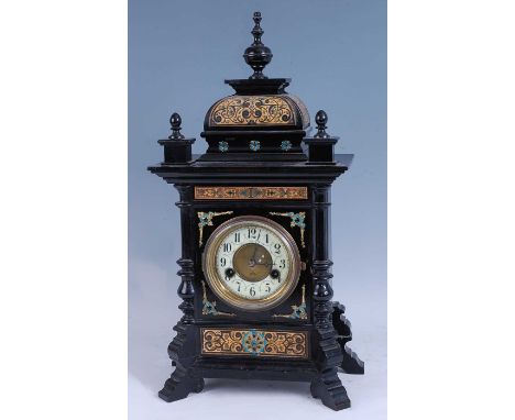 An Aesthetic Movement ebonised gilt metal mounted and further stylise floral decorated mantel clock, the case of architectura