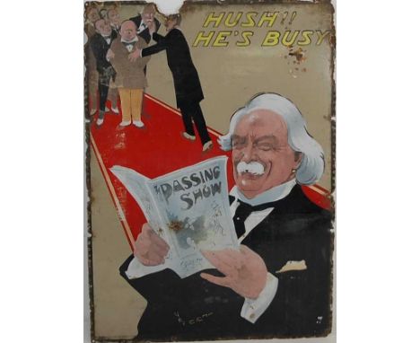 An early 20th century enamel on metal advertising sign 'Hush!! He's Busy, The Passing Show', depicting Lloyd George reading t