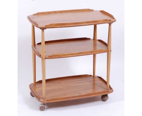 An Ercol light elm round cornered three-tier tea trolley, having raised sides and on roller castors, h.77cm, w.71cm, d.46cmCo