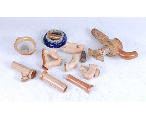 A collection of late 19th Doulton stoneware 'sanitary-ware' salesman's pipe samples, together with an advertising ashtray, in