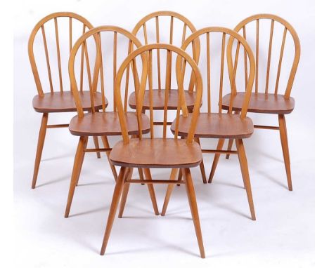 A set of six Ercol 1960s light elm stickback kitchen chairs, labels verso, w.40cm