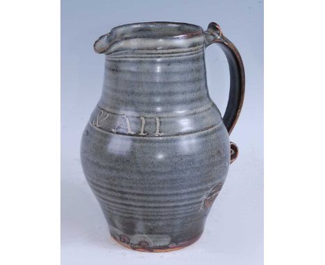 Leach Pottery of St Ives - a studio pottery jug, inscribed 'One &amp; All', partially glazed in tones of grey, impressed seal