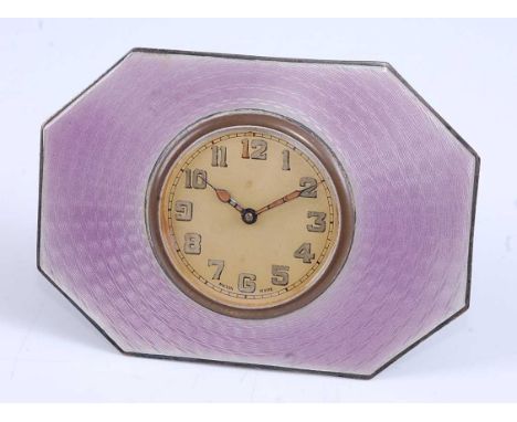 An Art Deco sterling silver and purple guilloche enamel decorated easel bedside clock, having winding movement and of octagon