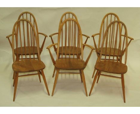 A set of four Ercol blond elm stickback elbow chairs, having dished seats, each w.62cm; together with a matching pair of side