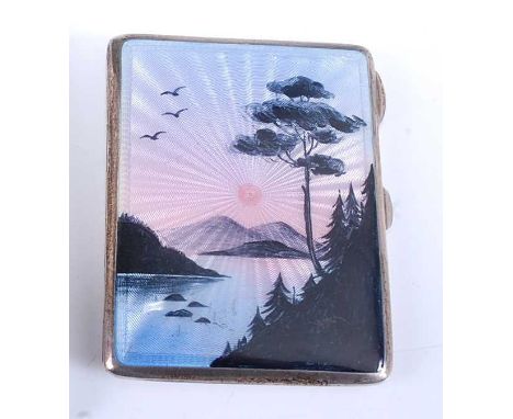 An Art Deco silver and enamel decorated pocket cigarette case, the guilloche enamelled cover decorated with a sunset lake sce