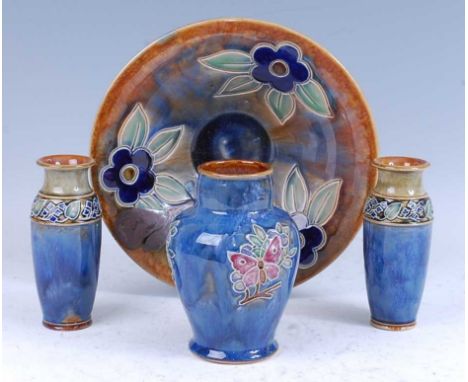 A 1935 Royal Doulton Lambeth stoneware bowl, with incised floral decoration, impressed marks verso, 28.5cm diameter, together