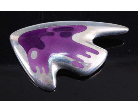 Henning Koppel (1918-1981) for Georg Jensen - a sterling silver stylised fish brooch, the body purple enamel decorated, raise