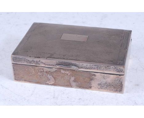 An Art Deco style silver table cigarette box, the slightly engine turned hinged cover enclosed cedar lined interior, maker Ch