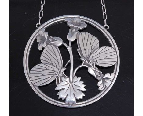 Arno Malinowski (1899-1976) for Georg Jensen - a sterling silver circular pendant, decorated with moonlight blossom, housed o