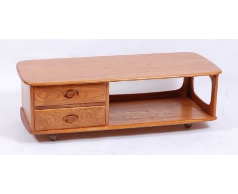 An Ercol light elm 'Pandora's Box' long coffee table, having twin short drawers, open compartment, rounded corners, and raise