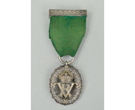 A VOLUNTEER OFFICERS DECORATION, un-named in silver, monogram 'VR' UK recipients