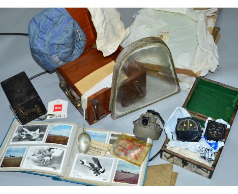 A LARGE BOX CONTAINING A NUMBER OF MILITARY RELATED ITEMS FROM THE WWII PERIOD, an afterwards including instruments, pieces o