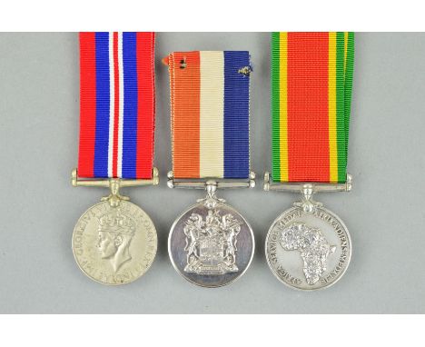 A GROUP OF THREE WWII MEDALS, Africa Service medal and War medal named to 39883 M.D.B. Janse Van Rensburg and South Africa 19