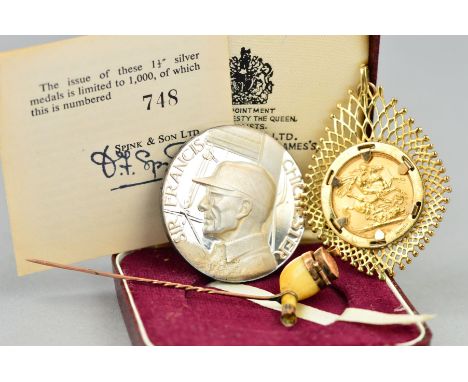 A FULL GOLD SOVEREIGN, mounted in a 9K setting, approximate weight 14 grams, a Spink medal in silver No.748, boxed with COA F