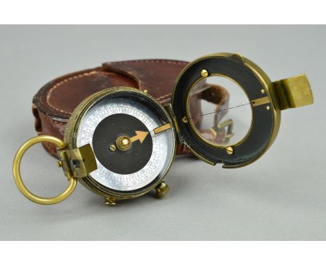 A VERNERS PATTERN 1915 MILITARY UK ISSUE OFFICERS COMPASS, complete with leather pouch by Cruchon & Emons, dated 1917, in goo