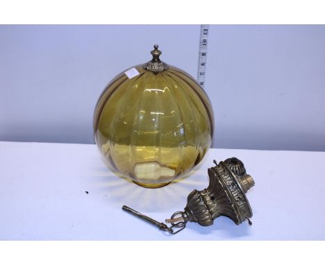 A antique glass globe ceiling light with brass fittings 