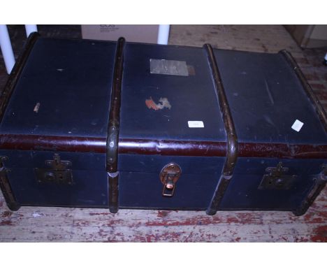 A vintage steamer trunk, postage unavailable 