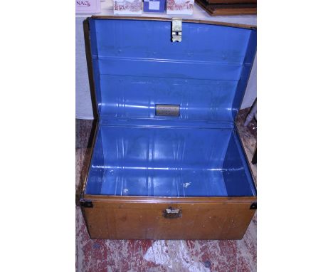 A large vintage metal trunk.  Postage unavailable 