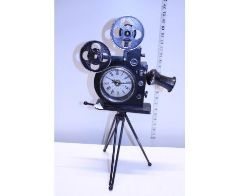 A novelty clock in the form of a vintage projector 