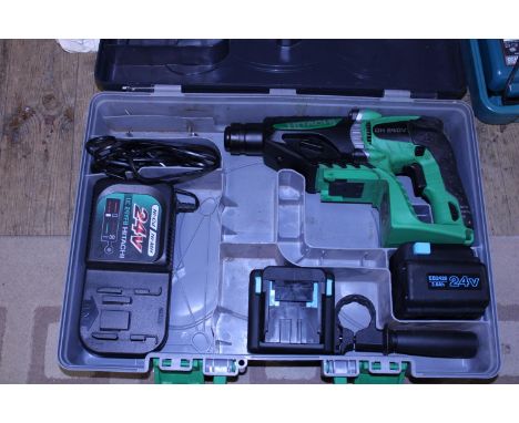 A boxed Hitachi cordless rotary hammer drill with batteries and charger 