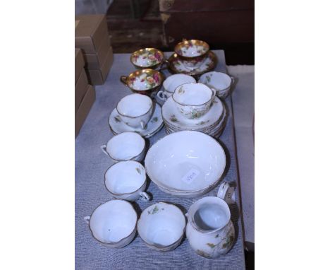 A vintage bone china tea service and three gold guilt cups and saucers, postage unavailable 