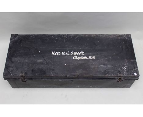 A black painted tin trunk with drop lock catches and cream painted interior 