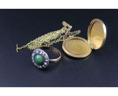 A 22ct gold band set with jade cabochon, surrounded by paced stones, together with a yellow metal pendant on chain