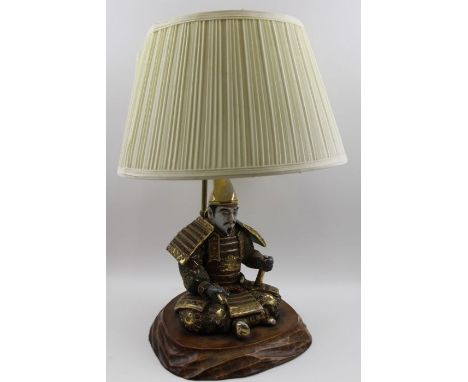 A 20th century table lamp, mounted with a Japanese satsuma ceramic figure of a seated Samurai, on wooden base with shade, 49c