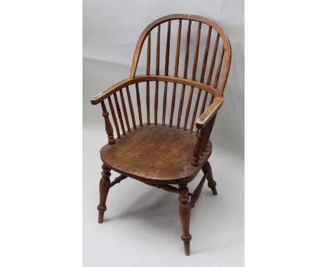 A hoop &amp; stick back armchair having well figured solid seat supported on four splayed legs united by H shaped stretcher 1